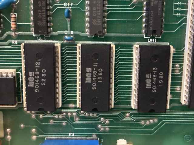 Three DIP28 ICs sitting next to each other on the board. 
